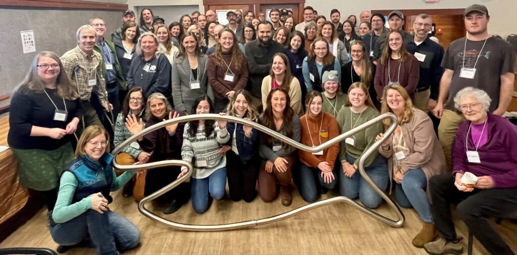 2023 Mat-Su Salmon Symposium attendees - with Happy Fish! Photo credit: Marian Giannulis/Trout Unlimited